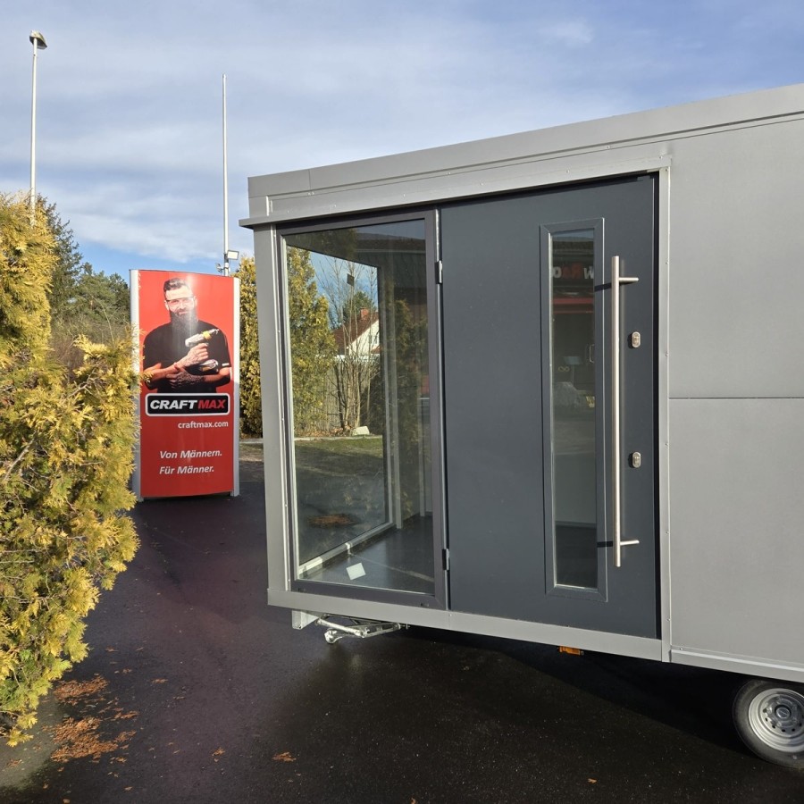 MobilOffice-2700-Thermo-Sandwichpanele-6.00-x-2.20-x-2.40m-grosse-Glasfenster-u.-Tuerelemente-Verkaufsklappe-1
